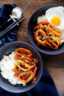 Korean spicy squid served on a bowl of rice