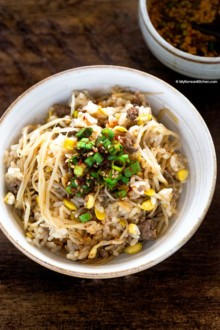 A bowl of soybean sprout rice. Topped with seasoning sauce