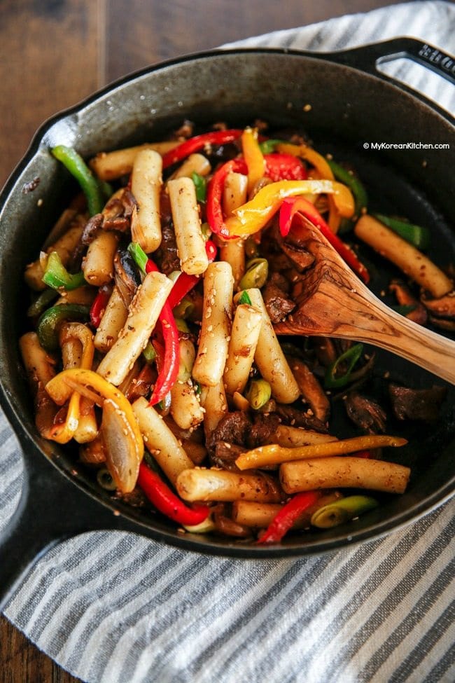 Gungjung Tteokbokki (Korean royal court rice cakes) recipe. This is a non-spicy Korean rice cake recipe. Stir fried with soy sauce, beef and vegetables. | MyKoreanKitchen.com