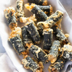 A close-up photo of gimmari piled on a serving plate.