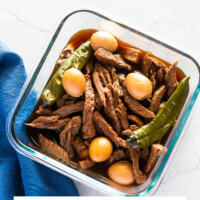 Finished Jangjorim, soy braised beef and quail eggs, in a glass container.