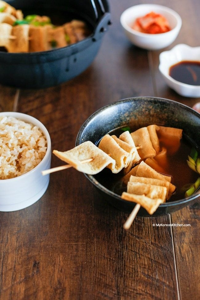 Korean fish cake soup served with steamed rice and other Korean side dishes | MyKoreanKitchen.com