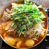 Boiling Gamjatang (Korean Pork Bone Soup) on gas bunner