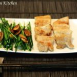 Garlic chives and baked garlic salad on a plate