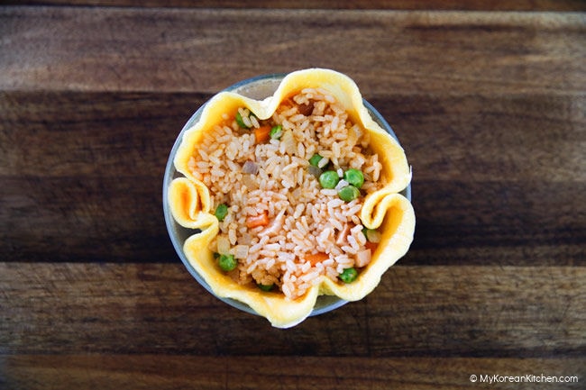 Omelette and fried rice tucked in a small bowl