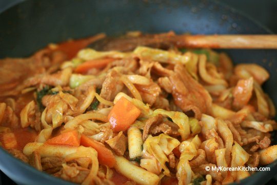 Jeyuk-bokkeum (Korean Spicy Pork Stir-Fry) cooking in the wok