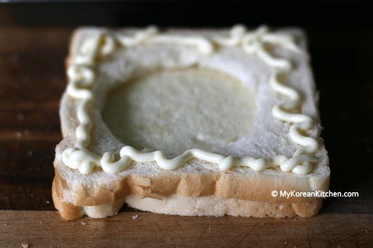 Mayonnaise on top slice of bread