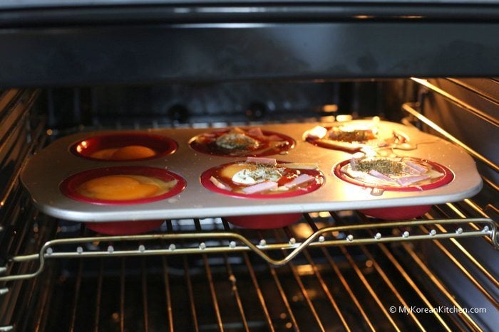 Put the muffin tray in the oven and bake it for 25 mins
