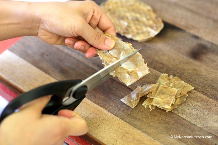 Step 1.Cut the fish jerky into bite size pieces with a pair of scissors