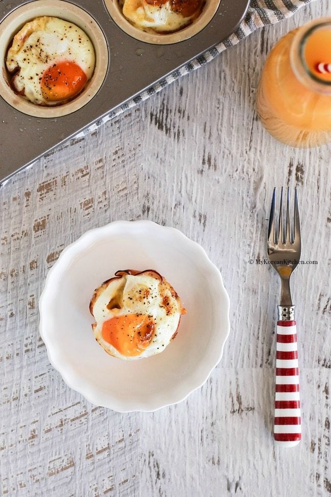 Ham and egg cup on a white plate