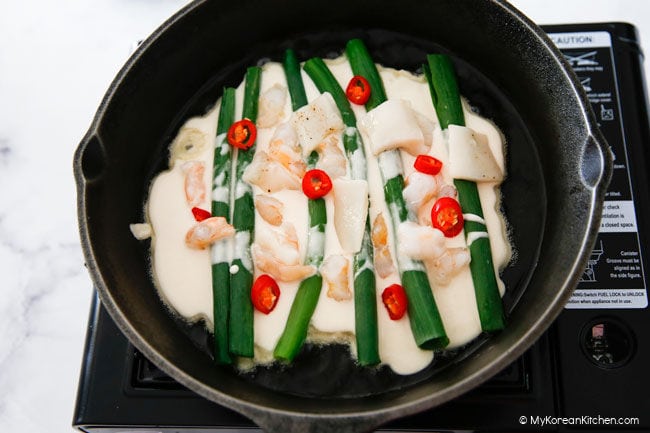 calamari, prawns and red chilies laid on pancake mix
