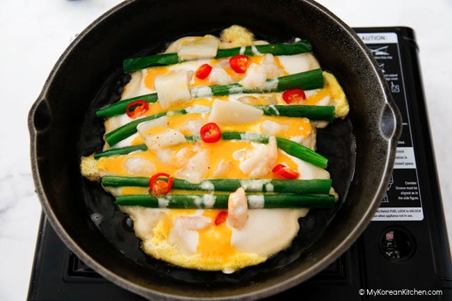 Adding beaten egg on pancake mix