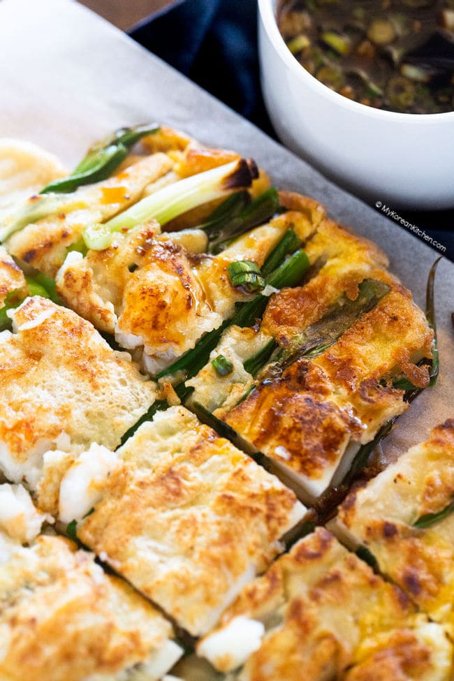 sliced pajeon served with Korean pancake dipping sauce