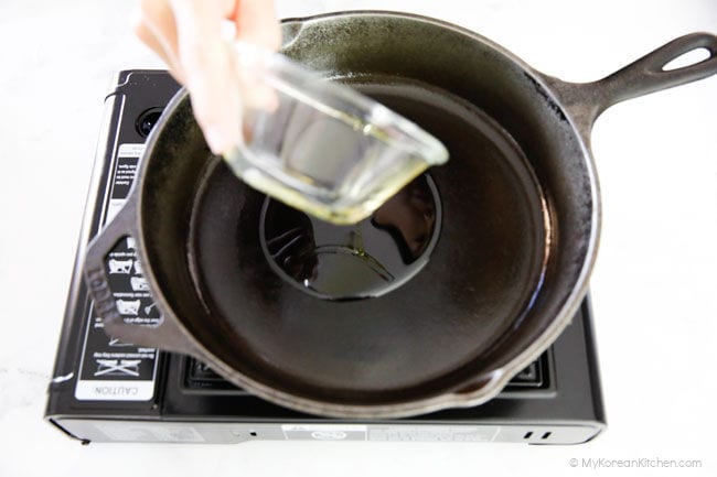 Adding oil in a skillet