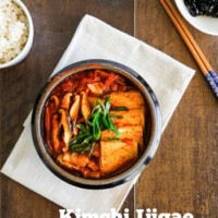 The classic Kimchi Jjigae (Kimchi stew) recipe with some fatty pork. When the fat from the pork melts into the soup, it becomes irresistibly delicious! | MyKoreanKitchen.com