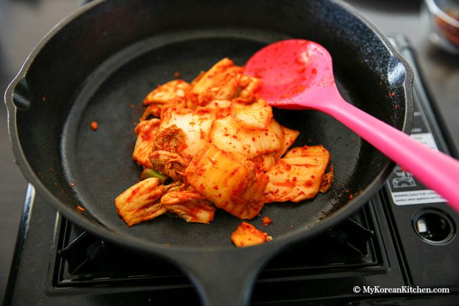 The classic Kimchi Jjigae (Kimchi stew) recipe with some fatty pork. When the fat from the pork melts into the soup, it becomes irresistibly delicious! | MyKoreanKitchen.com