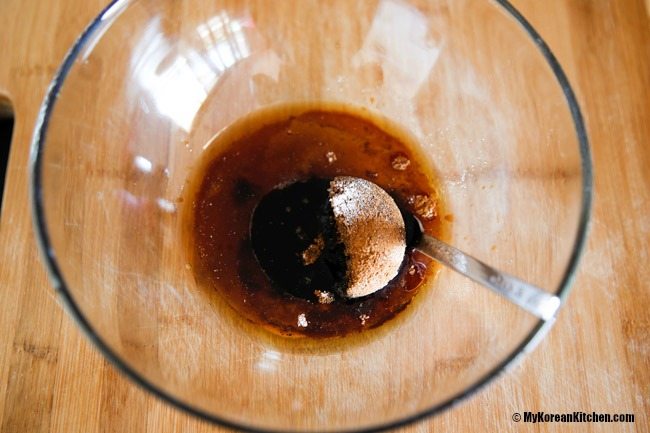 Mixing yaksik sauce ingredients in a bowl.