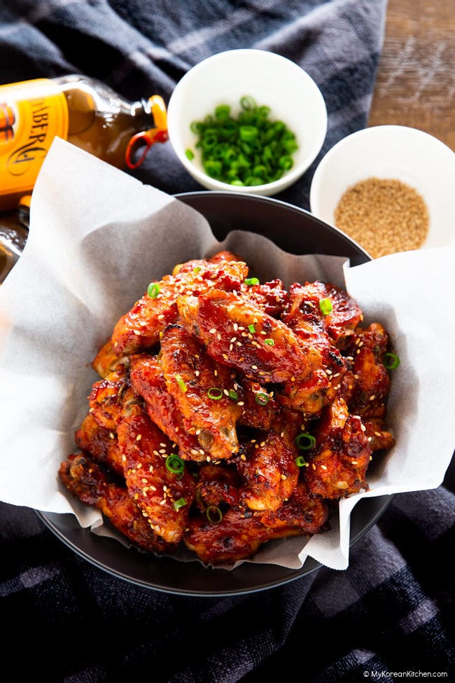 Korean baked chicken wings served in black pasta bowl