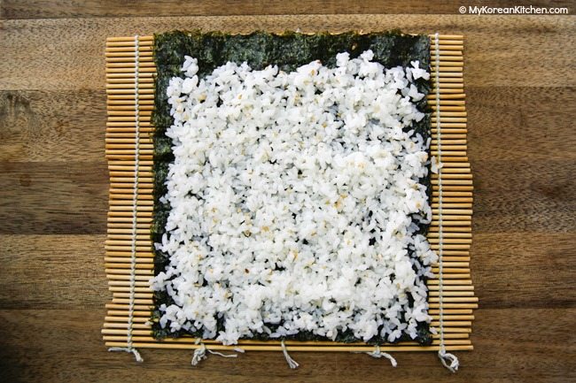 Sushi rice on bamboo mat