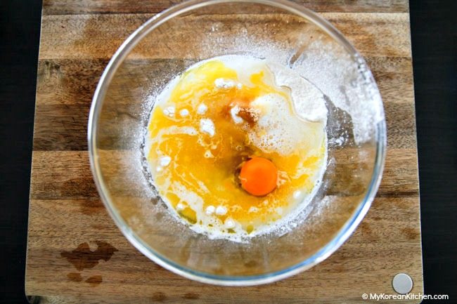 Making Korean walnut cake batter in a bowl
