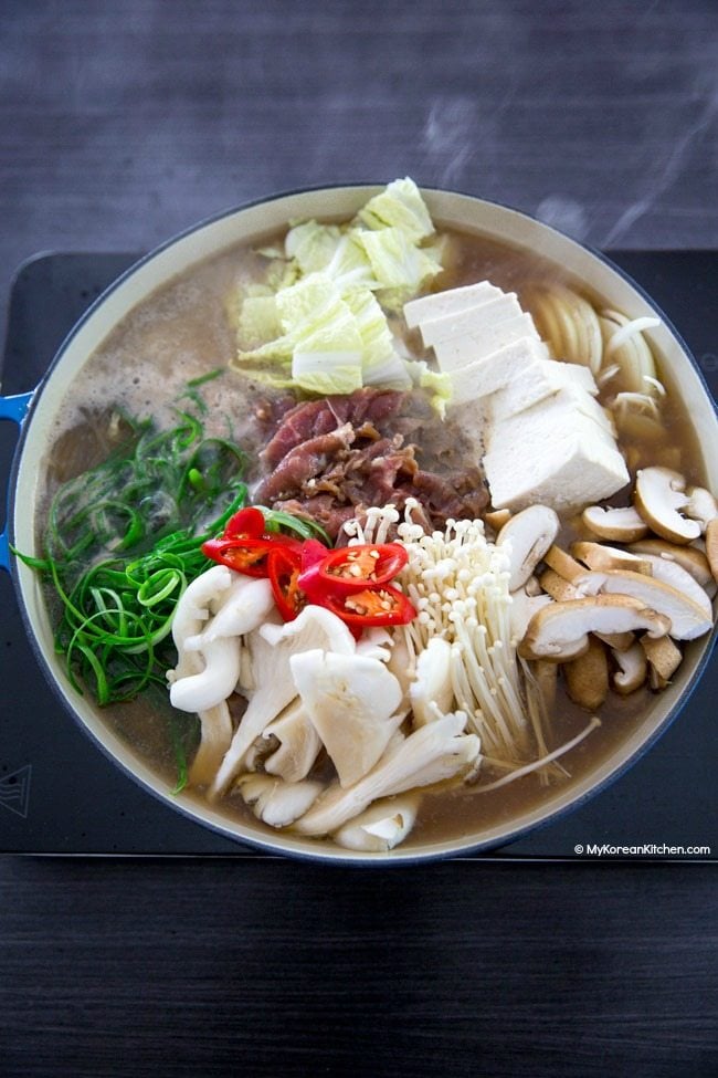 Boiling bulgogi jungol in a shallow pot