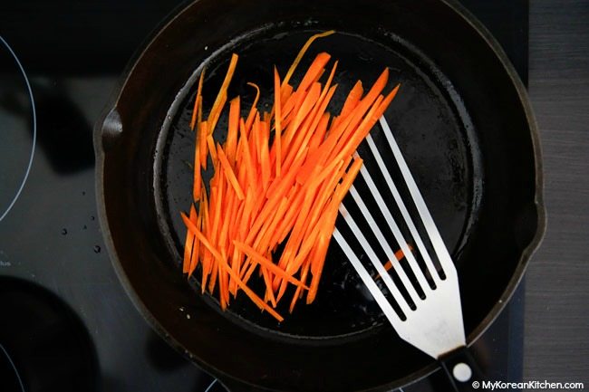 Stir frying julienned carrots
