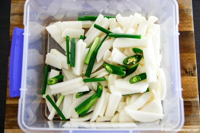 Dongchimi ingredients in a kimchi container