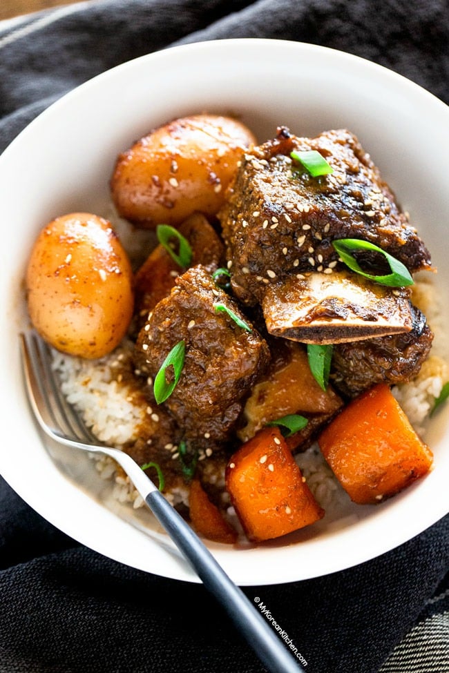 Korean short ribs served with baby potatoes and carrots over white rice