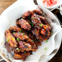 Korean chicken wings serve on paella pan