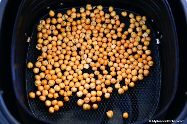 Roasted chickpeas in an air fryer basket