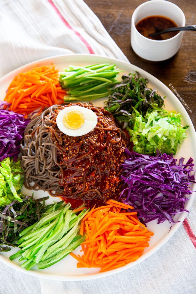 spicy noodles and vegetables on a large platter