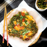 Chive pancake served on a basket plate