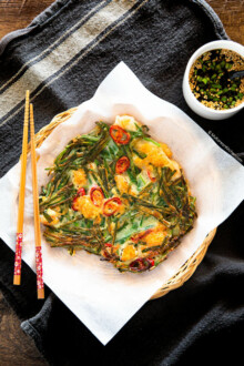 Chive pancake served on a basket plate