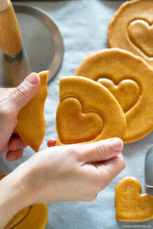 breaking dalgona while reserving the love heart shape