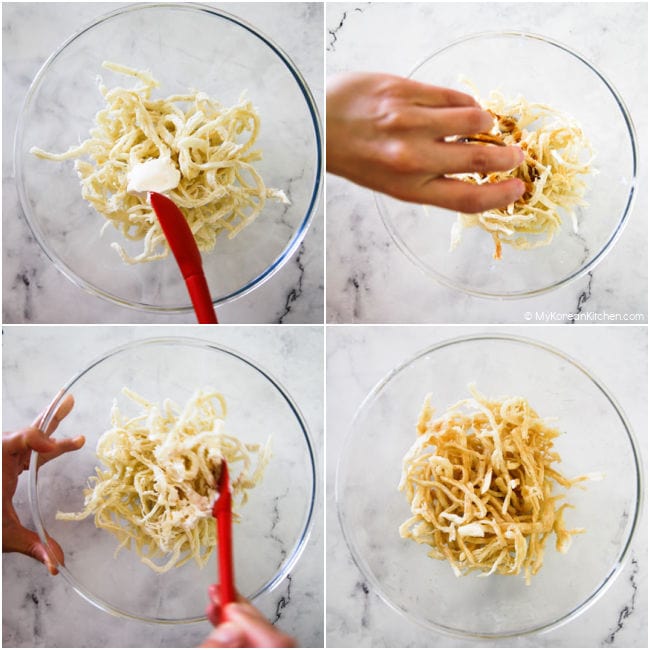 seasoning dried shredded squid in a mixing bowl