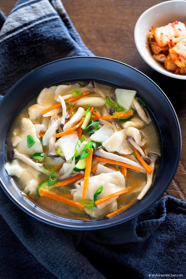 Korean hand pulled noodle soup served with kimchi.