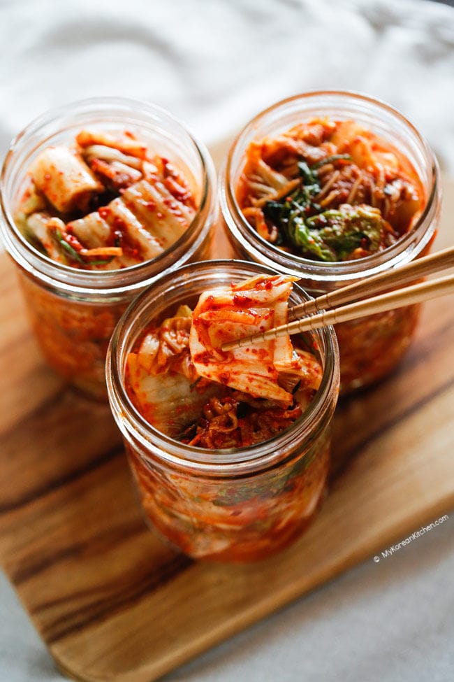 Three jars filled with kimchi