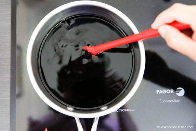 Making pickled onion brine over the stove