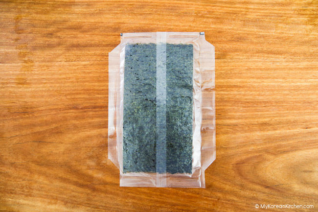 Dried seaweed on a wooden board.