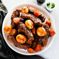 Instant pot pork ribs and vegetables, served on a plate.