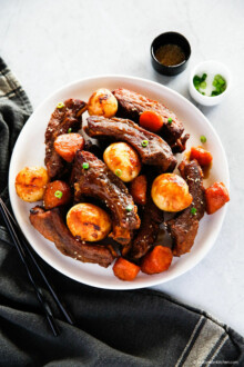 Instant pot pork ribs and vegetables, served on a plate.