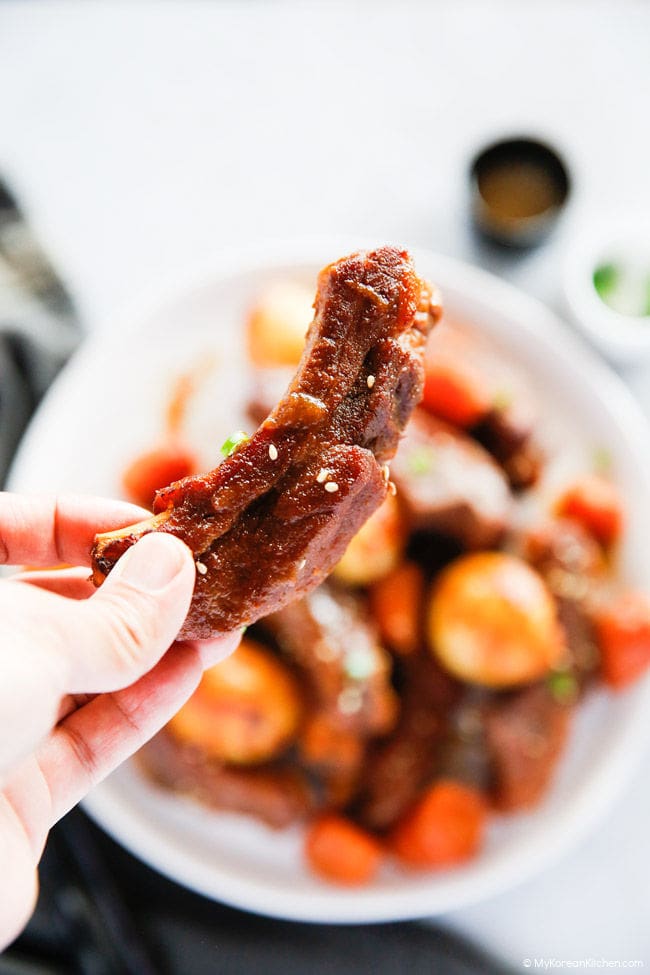 Holding pressure cooked pork ribs.