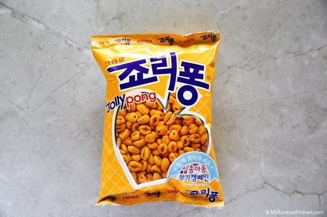 Korean snack, Jolly Pong (Jollypong) package on a cement background.