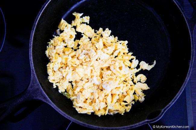 Making scrambled eggs in a skillet.