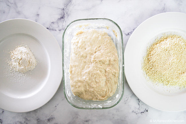 Flour, corn dog batter, and panko breadcrumbs are on the table.