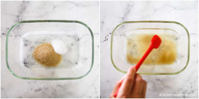 Mixing sugar, salt and water in a glass container with red spatula.