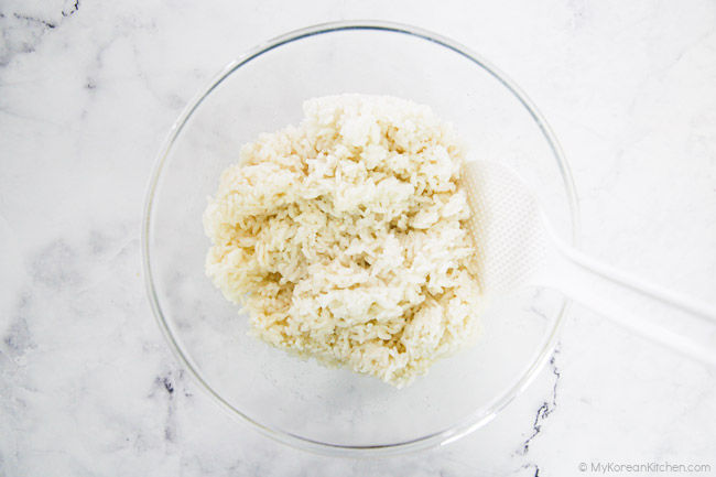 Seasoned rice in a mixing bowl.