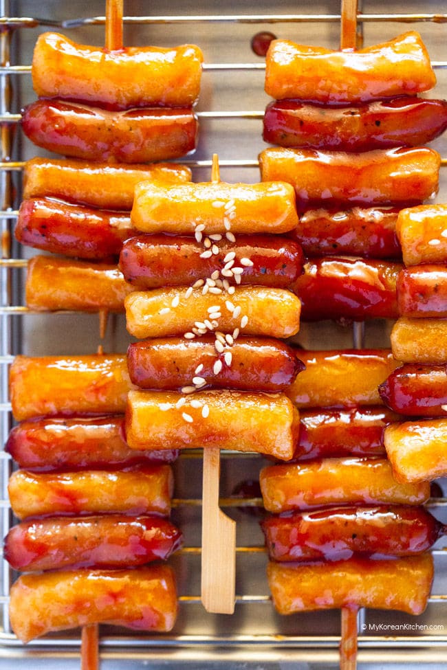 Sotteok skewers placed neatly on a stainless steel plate.