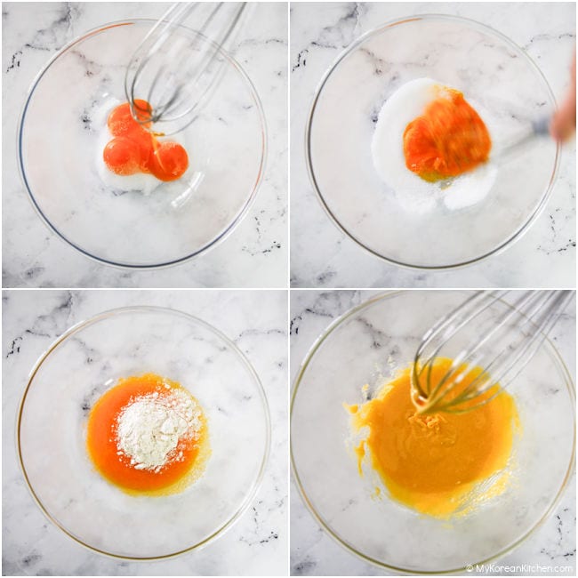 Combining egg yolk, sugar, and flour in a mixing bowl.