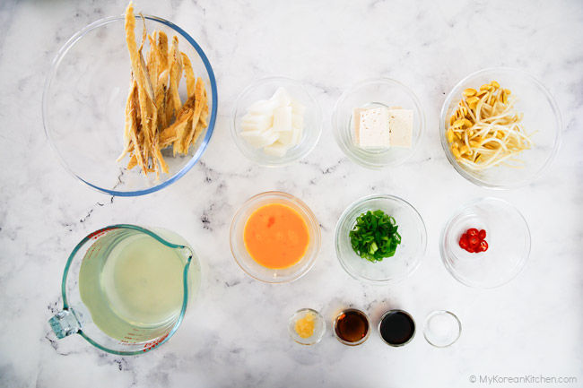 Dried pollack soup ingredients placed on a marble countertop.